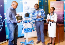 Andrew Waititu,General Manager GE Healthcare East Africa presents the equipment to SHOFCO CEO.jpg